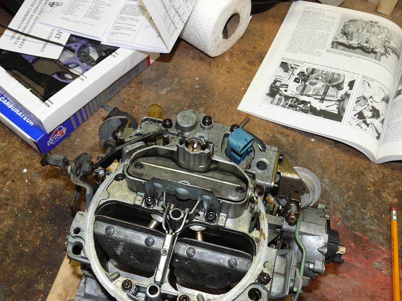 P1180168.JPG - Starting to rebuild the Quadrajet carburetor --after deciding to preserve pollution controls.