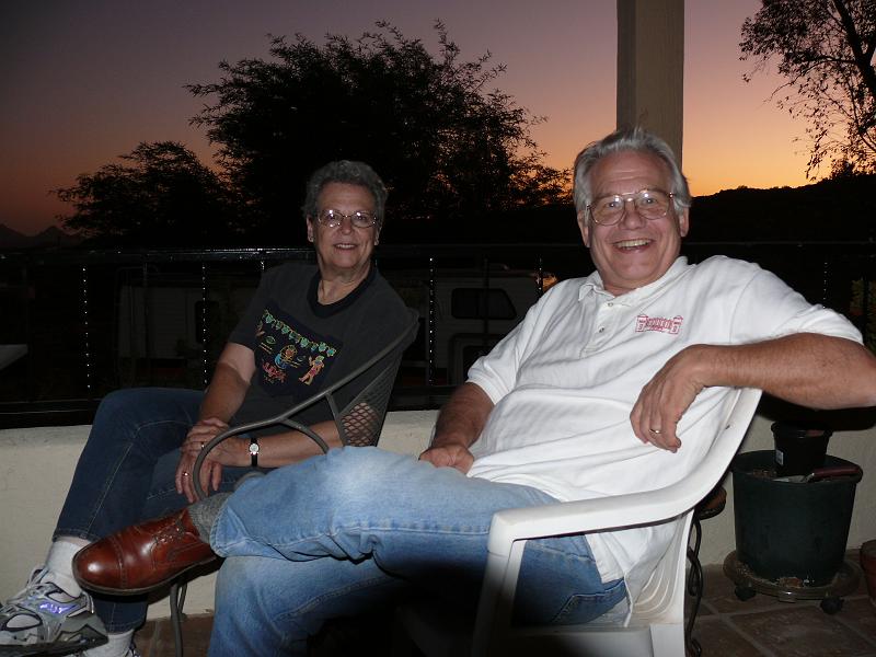 P1150851.JPG - Win & Michele on the Skane veranda with the sunset behind them.